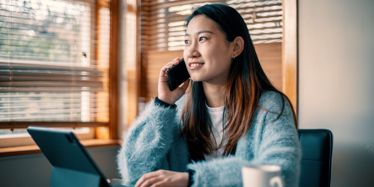 Woman on phone with laptop