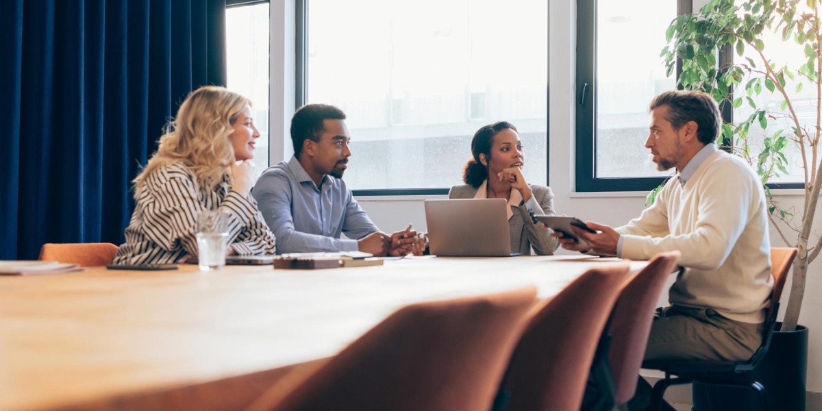 Four people collaborating at a table